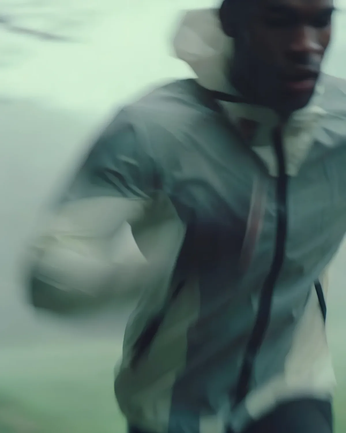 Motion study of a person in muted green tones